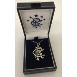 A 925 silver RFC (Rangers Football Club) pendant on a 18" curb chain.