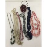 A collection of vintage and retro glass and plastic bead necklaces.