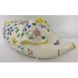 A very large vintage Arthur Woods ceramic piggy bank decorated with hand painted flowers.