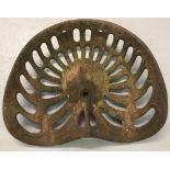 A vintage cast iron tractor seat marked "Bamford".