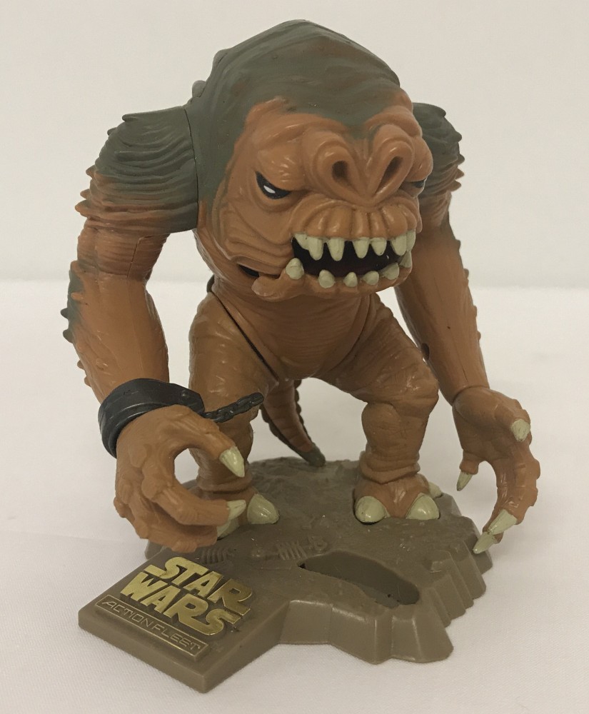 An unboxed 1996 Micro Machines Star Wars Action Fleet Rancor Monster on stand.