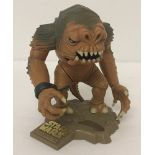 An unboxed 1996 Micro Machines Star Wars Action Fleet Rancor Monster on stand.