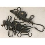 A small collection of vintage horse tack.