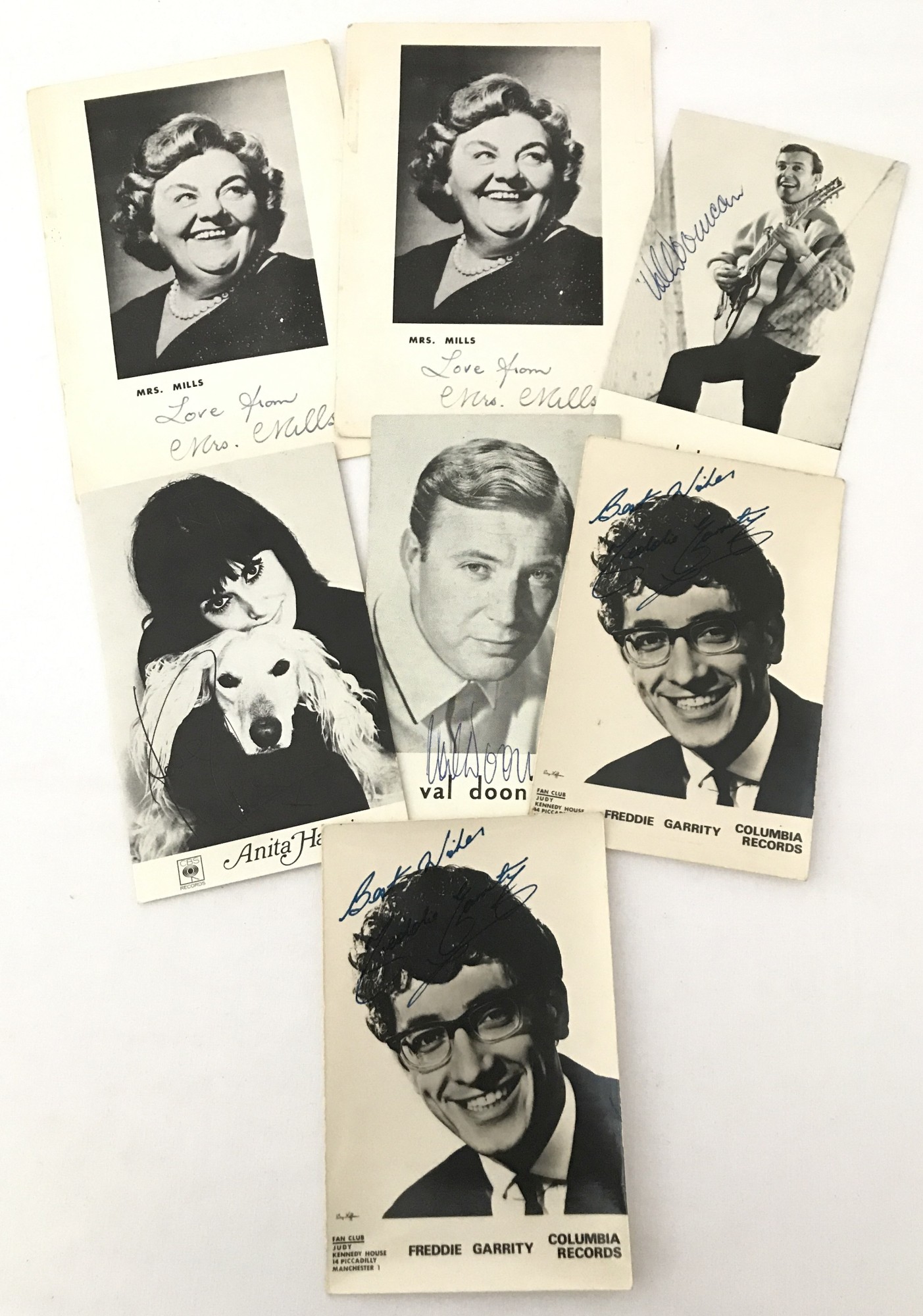 A collection of 7 Studio and fan club celebrity promotion cards with hand signed Autographs.