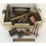 A box of mixed wooden items to include picture frames, miniature easels, trinket boxes & rulers.