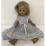 A 1930's ceramic fully jointed doll with flirty eyes.