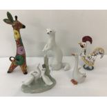 A small collection of ceramic animal and bird figurines.