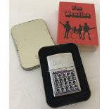 A cased The Beatles "A Hard Days Night" Collectors Zippo Lighter, unfueled and in as new condition.