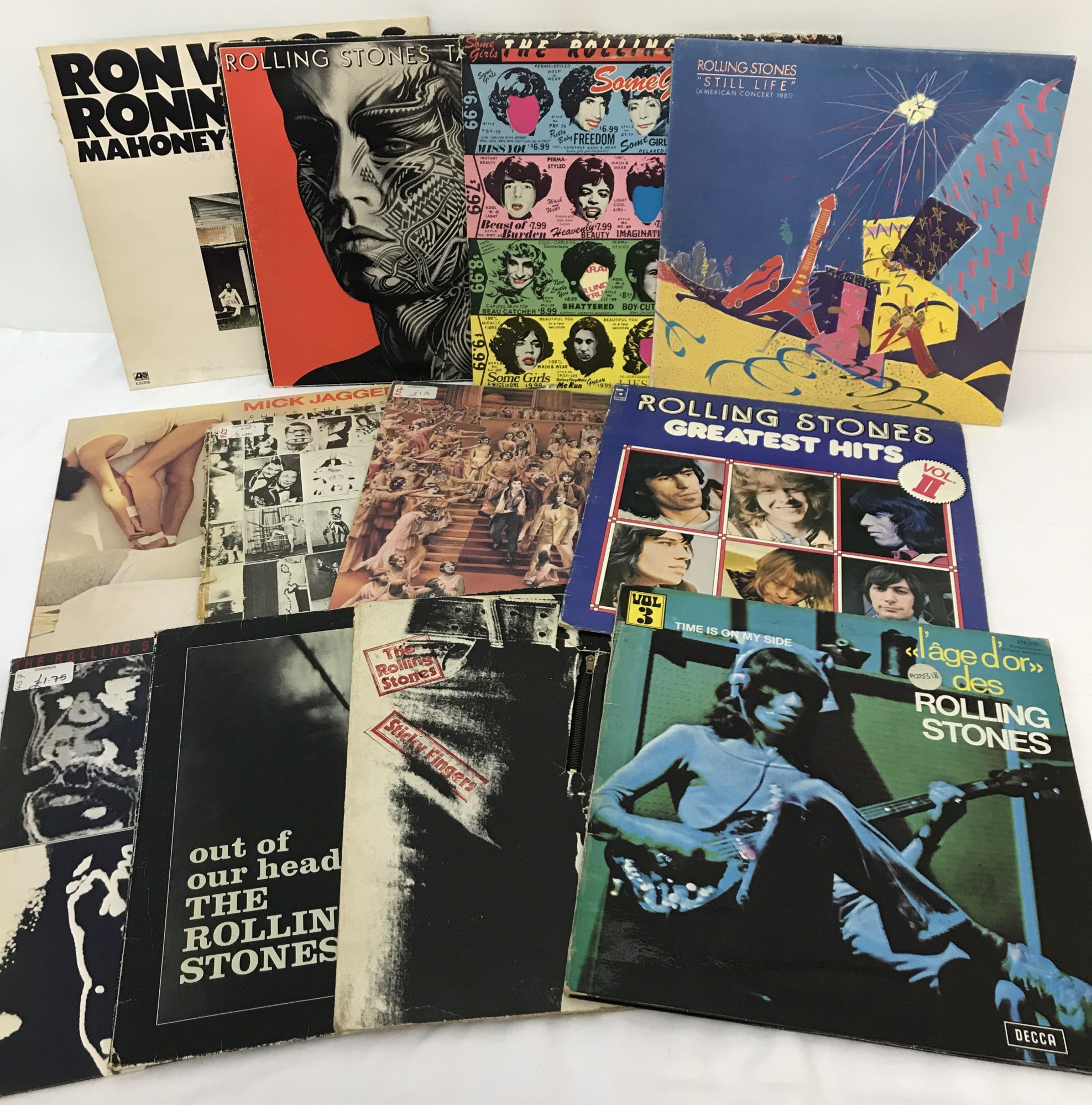 12 vintage Rolling Stones LP's - to include solo albums from Rolling Stones band members.