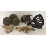 A collection of wooden and resin figures to include animals.