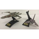 A 1995 Micro Machines Star Wars Action Fleet X Wing Fighter complete with figures inside and stand.