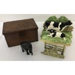 Two vintage letter racks, a small wooden box and carved wooden elephant.