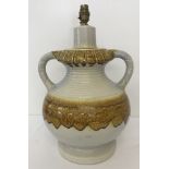 A large German ceramic 2 handled lamp base. Cream coloured with brown drip glaze design.