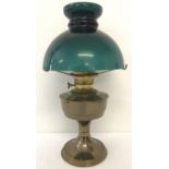 A vintage brass based "Aladdin" oil lamp complete with green glass shade.