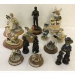 A collection of resin ornaments and figures.