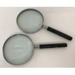 2 modern magnifying glasses.