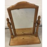 A modern pine free standing, swivel dressing table mirror.