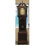A German dark wood long cased clock with turned column design and carved Fu Bat detail to door.