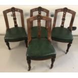 A set of 4 oak framed Victorian dining chairs with carved detail to chair backs and front legs.