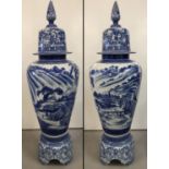 A very large Chinese blue and white ceramic lidded urn on a seperate pedestal base.