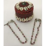 2 Indian white metal and red glass bead decorative ankle chains, both with makers marks.