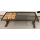 A retro glass and tile topped G Plan coffee table.