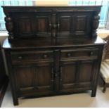 A vintage dark wood Ercol sideboard with 2 door 2 drawer base.