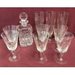 A cut glass decanter together with 6 large wine glasses and 3 etched vases.