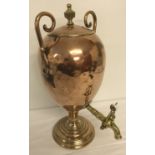 An antique copper and brass samovar.