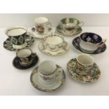 A collection of 8 cups & saucers and coffee cans.