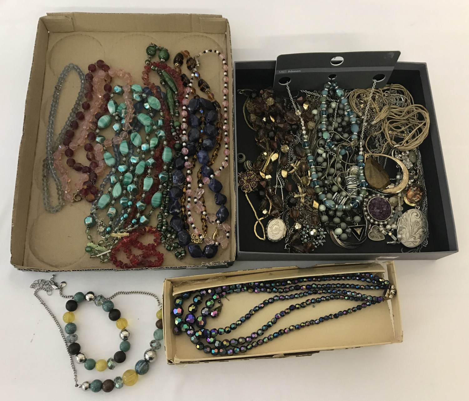 2 trays of vintage and modern necklaces.