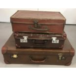 3 vintage brown leather effect suitcases.