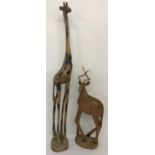 2 carved wooden animal figures. A giraffe with burnt wood pattern