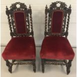 A pair of Victorian highly carved high back dining chairs with barley twist columns and stretchers.