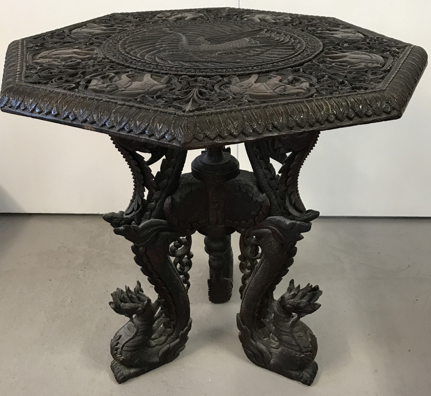 A late 19th century/early 20th century finely carved Burmese hardwood occasional table.