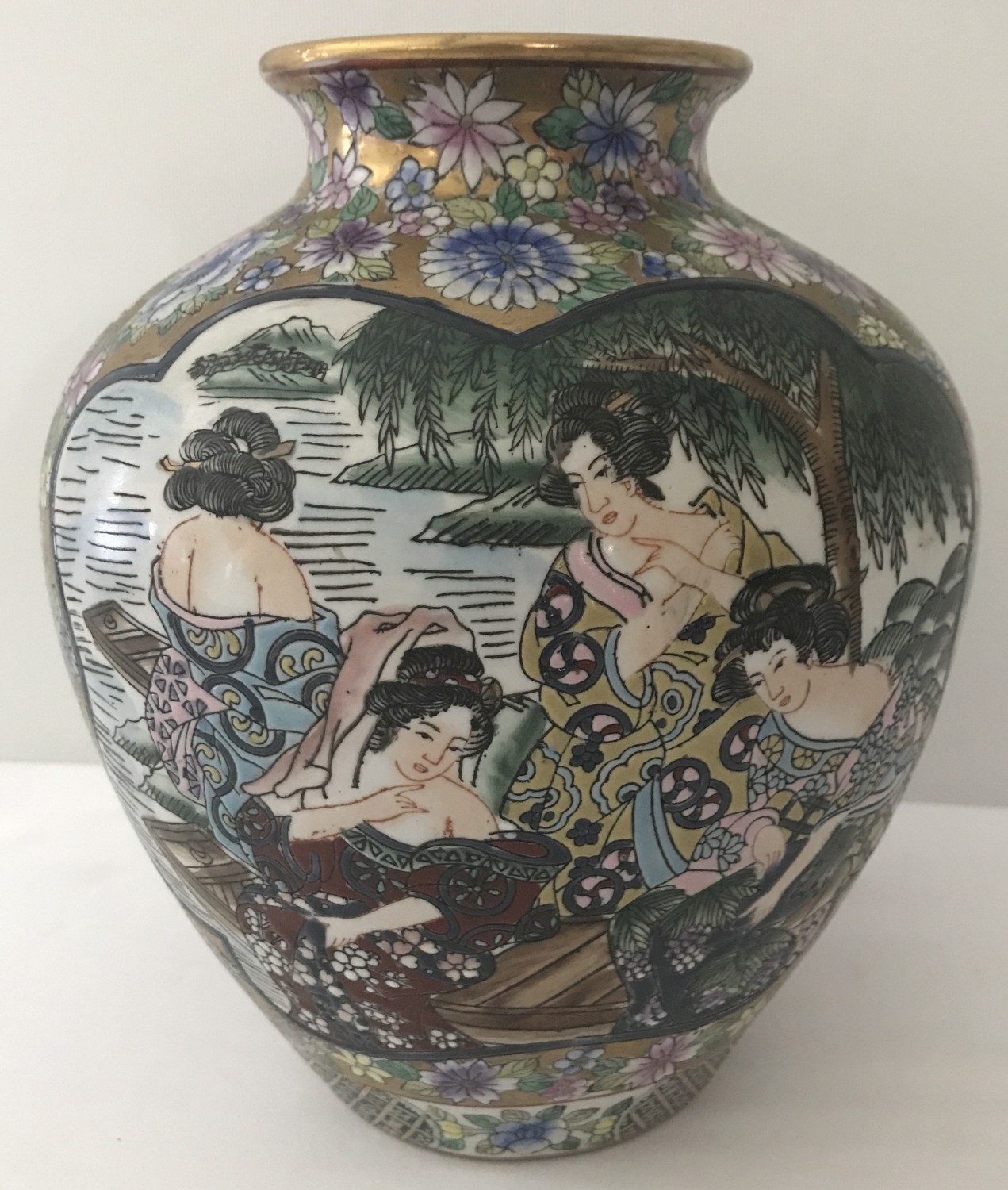 A bulbous shaped Famille Rose vase depicting oriental ladies getting ready to bathe.