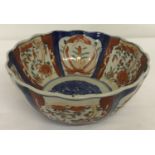A Chinese Imari bowl with scalloped rim and hand painted detail to interior and bowl surround.