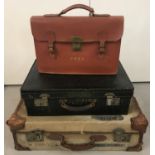 A collection of 3 vintage luggage items.