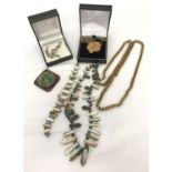 A small collection of vintage and modern costume jewellery.