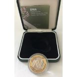 A DNA 2003 silver proof £2 coin from The Royal Mint.