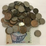 A small quantity of mixed British and foreign coins together with a Tunisian bank note.