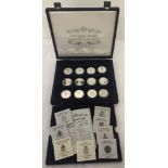 A boxed collection of 12 silver Queen Elizabeth II Coronation 50th Anniversary coins.