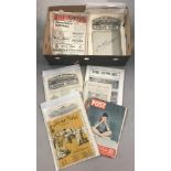 A box of antique and vintage newspapers, magazines and brochures.