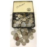 A tin of assorted foreign coins, mainly European.