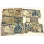 A small collection of vintage bank notes and coins.