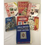 A collection of 7 stamp collecting books to include Stanley Gibbons.