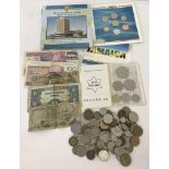 A small collection of foreign bank notes and coins.