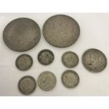 A small collection of George V coins to include crowns and threepences.