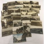 A collection of 30+ vintage postcards mostly relating to the fishing industry and coastal towns.