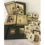 4 Victorian photograph albums containing a quantity of photographic scenes and portraits.